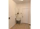 Laundry room with white cabinets, sink, and tile floor at 11318 Laurel Brook Ct, Riverview, FL 33569
