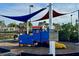 Play train on playground featuring a slide and covered seating. Includes playground rules at 11318 Laurel Brook Ct, Riverview, FL 33569