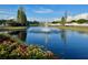 Pond in the community featuring a fountain, playground, and landscaping at 11318 Laurel Brook Ct, Riverview, FL 33569