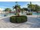 Community pool featuring tropical landscaping, a cabana, and poolside seating at 11318 Laurel Brook Ct, Riverview, FL 33569