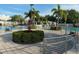 Community pool with swaying palm trees, poolside seating, and inviting lounge areas at 11318 Laurel Brook Ct, Riverview, FL 33569