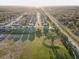 Elevated aerial view showing the home's position relative to nearby community amenities at 11422 Calusa Trails Way, Riverview, FL 33569