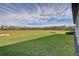 Expansive backyard with lush green grass perfect for outdoor activities and relaxation at 11422 Calusa Trails Way, Riverview, FL 33569