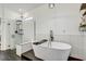 Elegant bathroom with a standalone soaking tub and a separate glass shower at 11422 Calusa Trails Way, Riverview, FL 33569