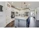 Spacious kitchen with modern appliances, a large island, and ample counter space at 11422 Calusa Trails Way, Riverview, FL 33569