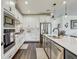 Gourmet kitchen featuring modern appliances, tile backsplash, and ample counter space at 11422 Calusa Trails Way, Riverview, FL 33569