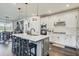 Open concept kitchen with large center island, stainless appliances, and modern finishes at 11422 Calusa Trails Way, Riverview, FL 33569