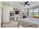 Bright bedroom with large window, sleek dresser, and a comfortable bed at 11422 Calusa Trails Way, Riverview, FL 33569