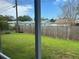 View of a fenced backyard with lawn, offering private outdoor space at 12054 145Th St, Largo, FL 33774