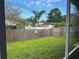 Fenced backyard with lawn and mature trees offer private outdoor living at 12054 145Th St, Largo, FL 33774