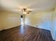 Light-filled bedroom with wood-look flooring, ceiling fan, and a single window at 12054 145Th St, Largo, FL 33774