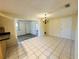 Bright dining area with neutral tile flooring and decorative chandelier at 12054 145Th St, Largo, FL 33774