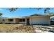 Charming single-story home with a well-maintained yard and attached two-car garage at 12054 145Th St, Largo, FL 33774