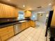 Functional kitchen boasting ample counter space, stainless steel appliances, and white-tiled flooring at 12054 145Th St, Largo, FL 33774