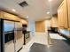 Well-lit kitchen featuring stainless steel appliances, generous cabinet storage, and an efficient layout at 12054 145Th St, Largo, FL 33774