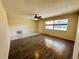 Bright living room featuring hardwood floors, ceiling fan and abundant natural light at 12054 145Th St, Largo, FL 33774