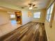 Cozy living room with wood-look floors and lots of natural light at 12054 145Th St, Largo, FL 33774