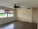 Bedroom featuring wood floors, a ceiling fan and natural light from the window at 12054 145Th St, Largo, FL 33774