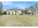 Spacious backyard featuring a screened-in patio, great for outdoor entertaining at 13403 Bolton Ct, Spring Hill, FL 34609