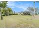 Enjoy a huge green backyard with a screened in patio at 13403 Bolton Ct, Spring Hill, FL 34609