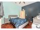 This primary bedroom features aqua and navy paint and a large window for lots of natural light at 13403 Bolton Ct, Spring Hill, FL 34609