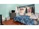 This bedroom features hardwood floors and a large closet with sliding doors at 13403 Bolton Ct, Spring Hill, FL 34609