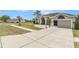 Attractive single-Gathering home with a two-car garage, pristine driveway, and manicured front yard at 13403 Bolton Ct, Spring Hill, FL 34609
