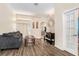 Cozy living room with hardwood floors, neutral walls, and comfortable seating arrangement at 13403 Bolton Ct, Spring Hill, FL 34609