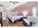 Comfortable main bedroom featuring a ceiling fan, and view to an ensuite bathroom at 13403 Bolton Ct, Spring Hill, FL 34609