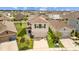 Two-story home in a suburban community, showcasing a well-manicured lawn, a driveway, and a two-car garage at 17006 Wave Tressle Pl, Wimauma, FL 33598