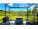 Beautiful backyard featuring outdoor seating, bar area, a scenic nature preserve, and a clear blue sky at 17212 Balance Cv, Land O Lakes, FL 34638