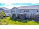 A picturesque backyard with a screened patio, showcasing the outdoor living space at 17212 Balance Cv, Land O Lakes, FL 34638