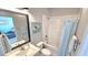 Clean bathroom with a single vanity, toilet, and shower/tub with light blue shower curtain at 17212 Balance Cv, Land O Lakes, FL 34638
