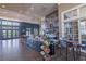 Interior cafe space featuring comfortable seating, televisions, and an expansive service bar at 17212 Balance Cv, Land O Lakes, FL 34638