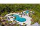 Aerial view highlighting the luxurious community pools, lounging areas, and lush landscaping at 17212 Balance Cv, Land O Lakes, FL 34638