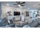 Comfortable living room offers a stylish decor with ceiling fan, neutral tones, and cozy seating at 17212 Balance Cv, Land O Lakes, FL 34638