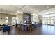 A spacious lounge featuring a coffee bar, several chairs, and tables that offer an area to relax at 17212 Balance Cv, Land O Lakes, FL 34638