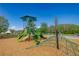 Community playground features a climbing web, slides, and a shaded play structure, offering recreational opportunities for children at 17212 Balance Cv, Land O Lakes, FL 34638