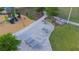 Aerial view of a community playground featuring hopscotch, foosball tables, and a ping pong table at 17212 Balance Cv, Land O Lakes, FL 34638