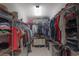 Spacious walk-in closet featuring ample shelving and hanging storage for organization at 17212 Balance Cv, Land O Lakes, FL 34638