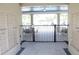 View of a gated community amenity, with mailboxes and covered seating area with tables and chairs at 17833 Althea Blue Pl, Lutz, FL 33558