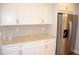 Kitchen area features granite countertops, stainless steel appliances, and ample cabinet space at 17833 Althea Blue Pl, Lutz, FL 33558