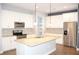 Spacious gourmet kitchen with granite countertops and stainless steel appliances at 17833 Althea Blue Pl, Lutz, FL 33558