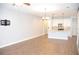 Open-concept living room showcasing the kitchen island with breakfast bar at 17833 Althea Blue Pl, Lutz, FL 33558