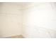 Empty walk-in closet featuring built-in white wire shelving at 17833 Althea Blue Pl, Lutz, FL 33558
