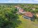 Aerial view of homes nestled among lush greenery, each with a screened pool, offering a private oasis at 1804 Bella Casa Ct, Tampa, FL 33618