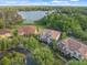 Aerial view of beautiful homes situated on a waterfront property with lush landscaping and serene lake views at 1804 Bella Casa Ct, Tampa, FL 33618