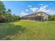 Expansive backyard features a screened pool and patio, perfect for outdoor entertaining and enjoying the lush surroundings at 1804 Bella Casa Ct, Tampa, FL 33618