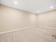 Finished basement area with neutral paint and carpet at 1804 Bella Casa Ct, Tampa, FL 33618