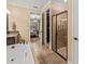 Beautiful bathroom featuring a separate tub, a walk in shower and a doorway to the bedroom at 1804 Bella Casa Ct, Tampa, FL 33618